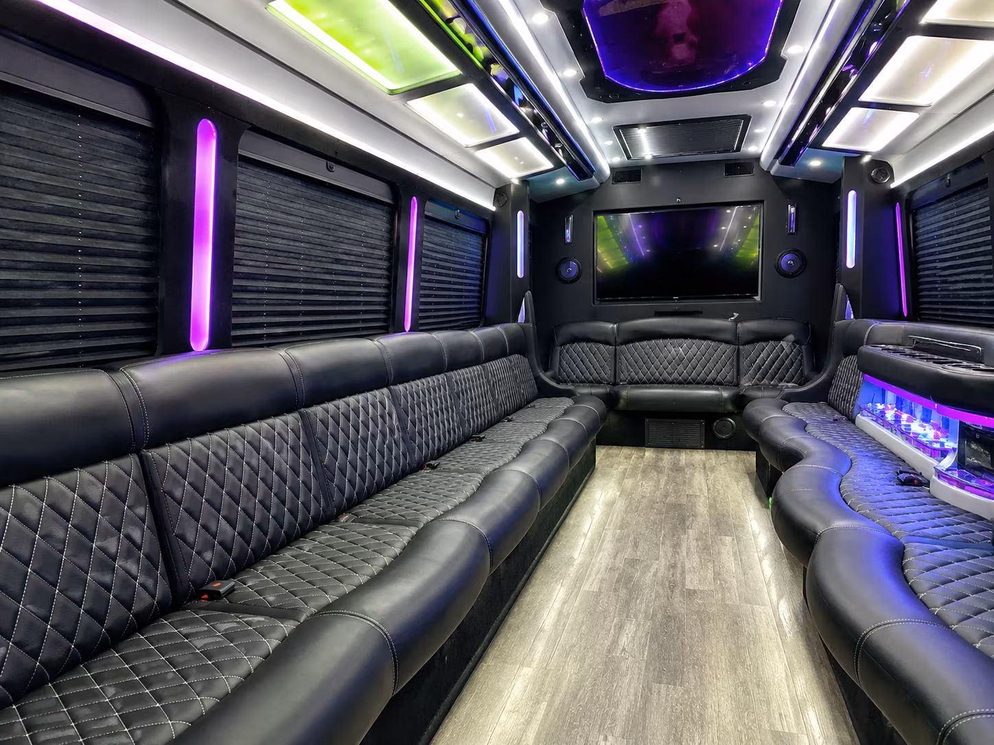 Friends laughing during a Alexandria party bus celebration
